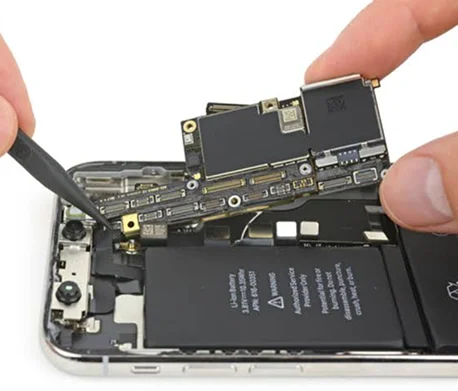 Close-up of a mobile phone being repaired