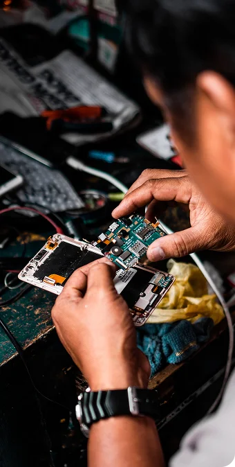 JD Phones technician repairing a mobile phone