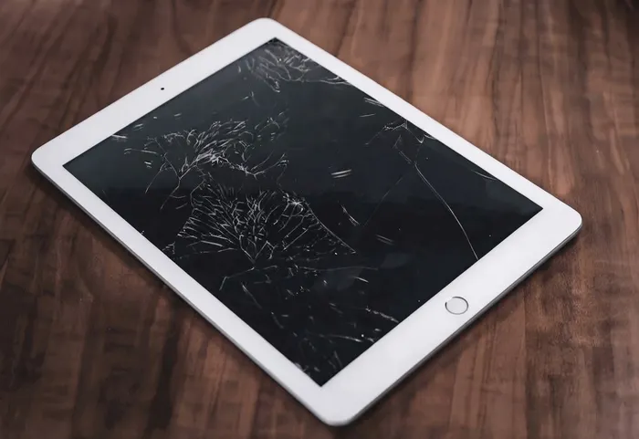 iPad with a cracked screen being assessed for repair