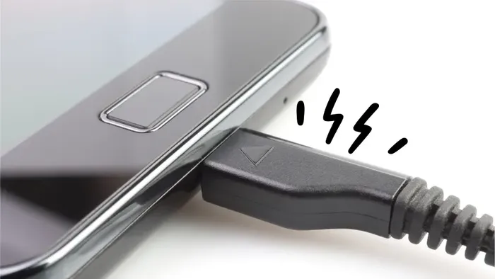 Close-up of a Samsung phone charging port being inspected