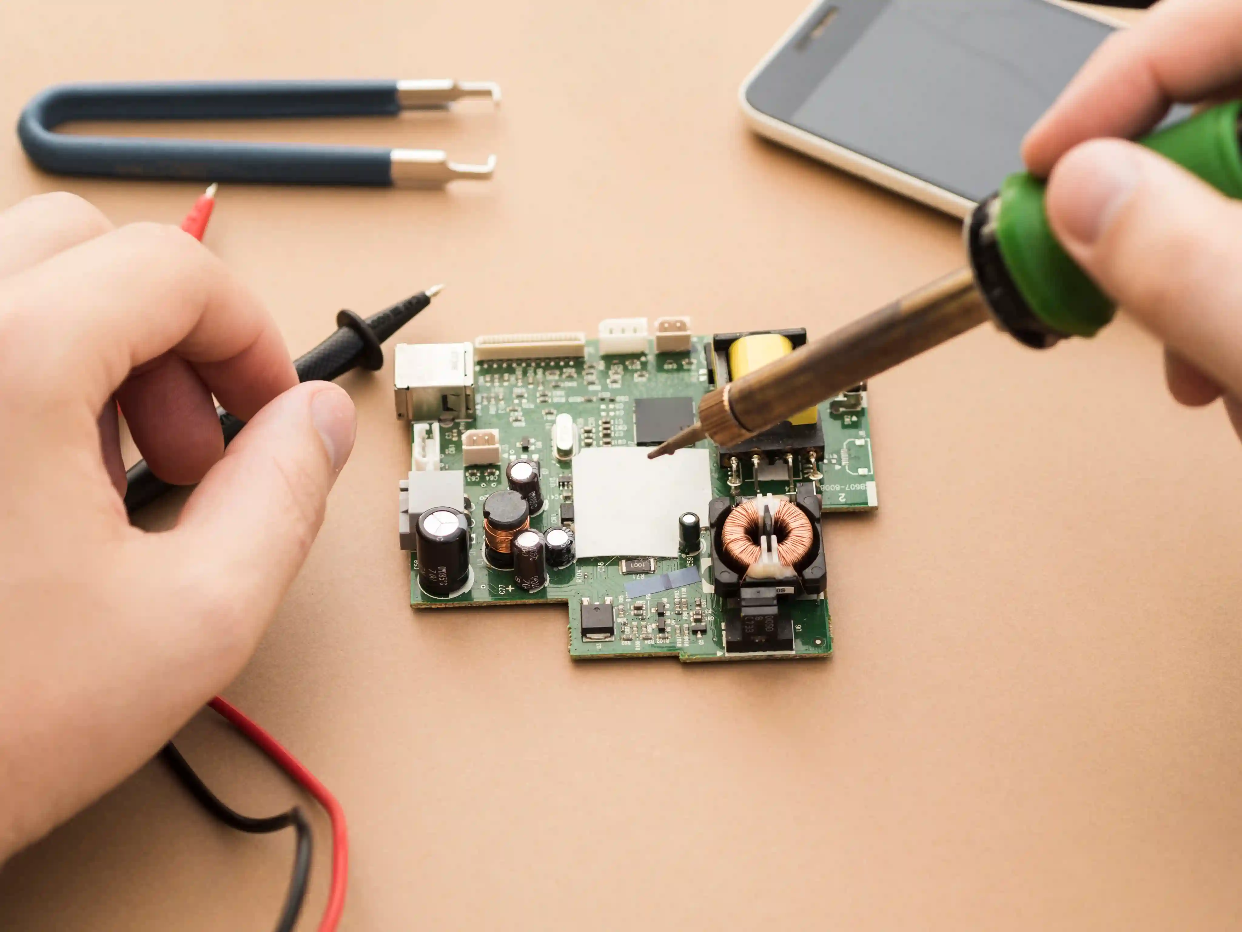 JD Phones technician repairing a smartphone in Heaton.